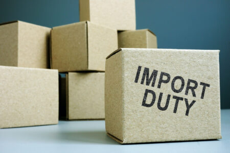 Import duty concept. Pile of cardboard boxes.